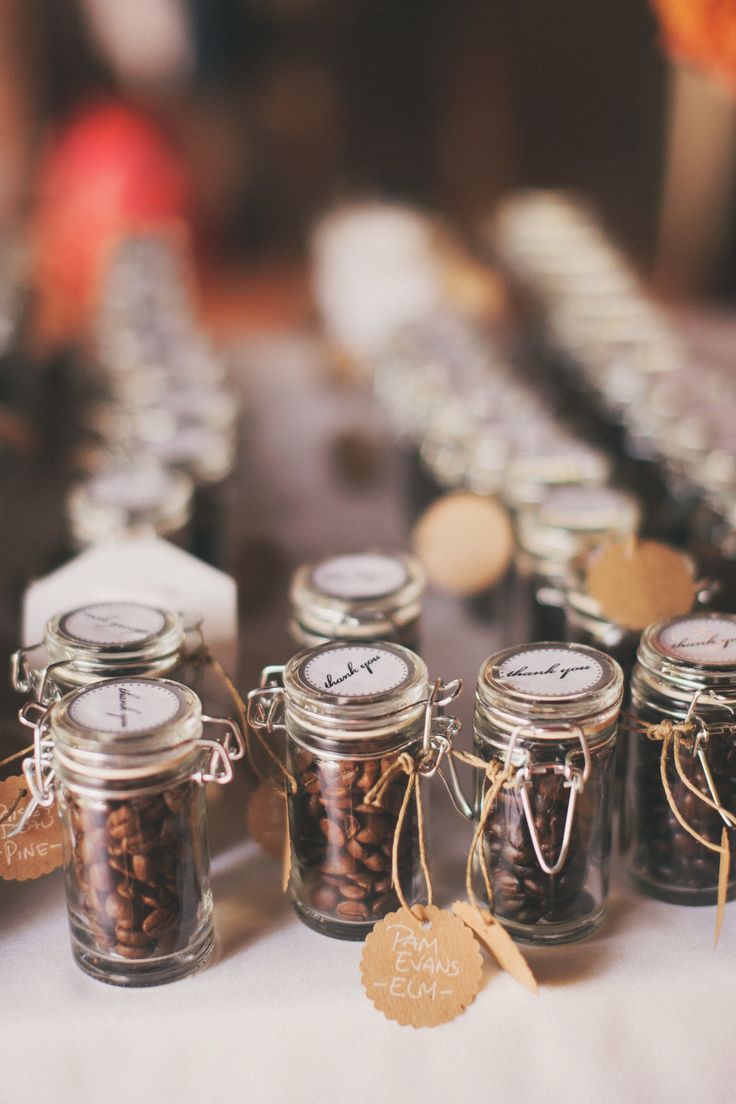 several jars filled with spices sitting on top of a table