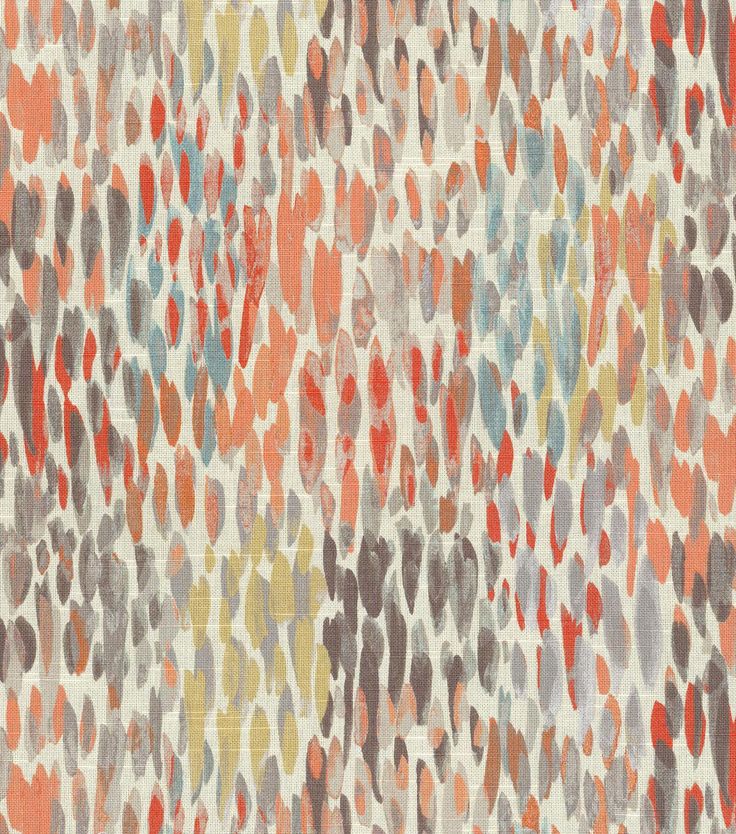 an orange, grey and white rug with different colored spots on it's surface