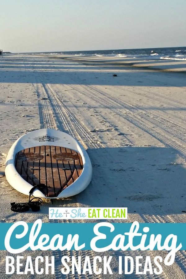 a boat sitting on top of a sandy beach next to the ocean with text overlay that reads clean eating beach snack ideas