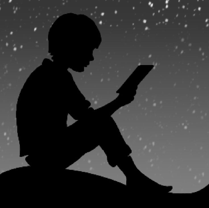 a silhouette of a person sitting on a hill reading a book at night with stars in the sky