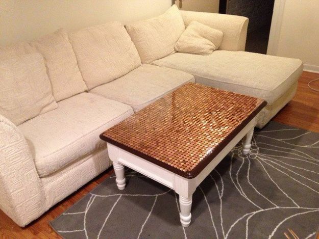 a living room with a couch, coffee table and rug