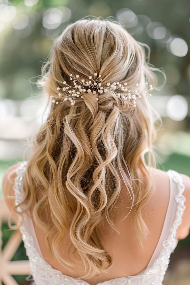 the back of a woman's head wearing a wedding hair comb