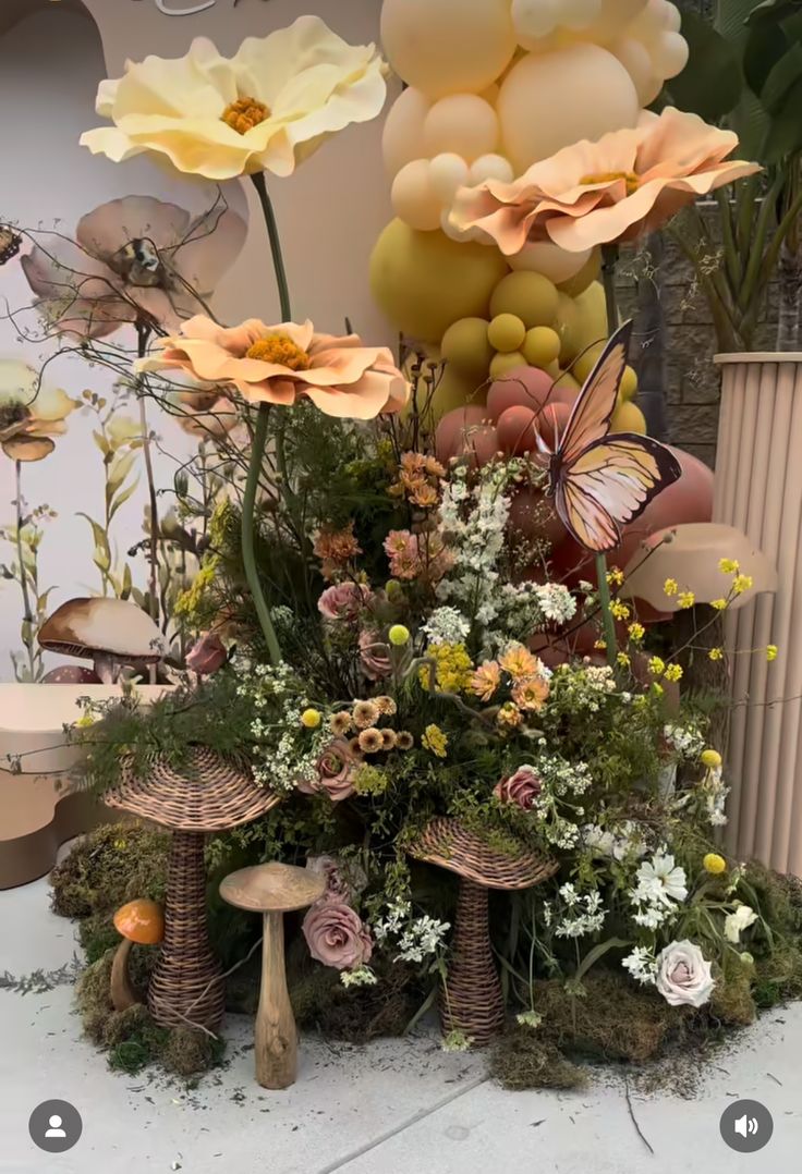 an arrangement of flowers and plants on display