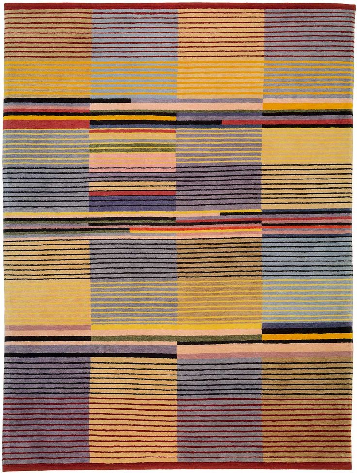 a multicolored rug with stripes and lines on the bottom, in various colors