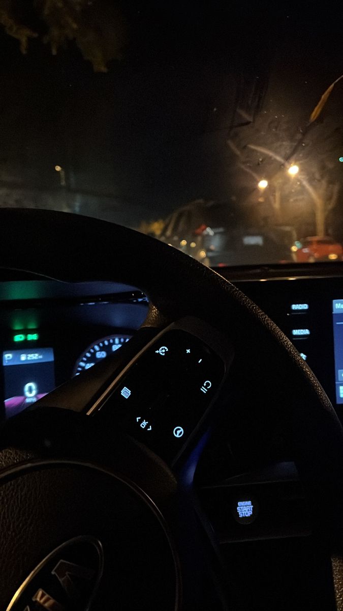 the dashboard of a car at night time