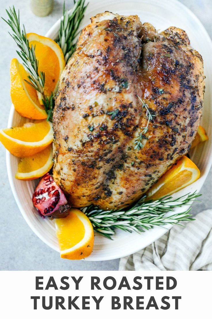 an easy roast turkey breast with oranges and rosemary garnish on the side