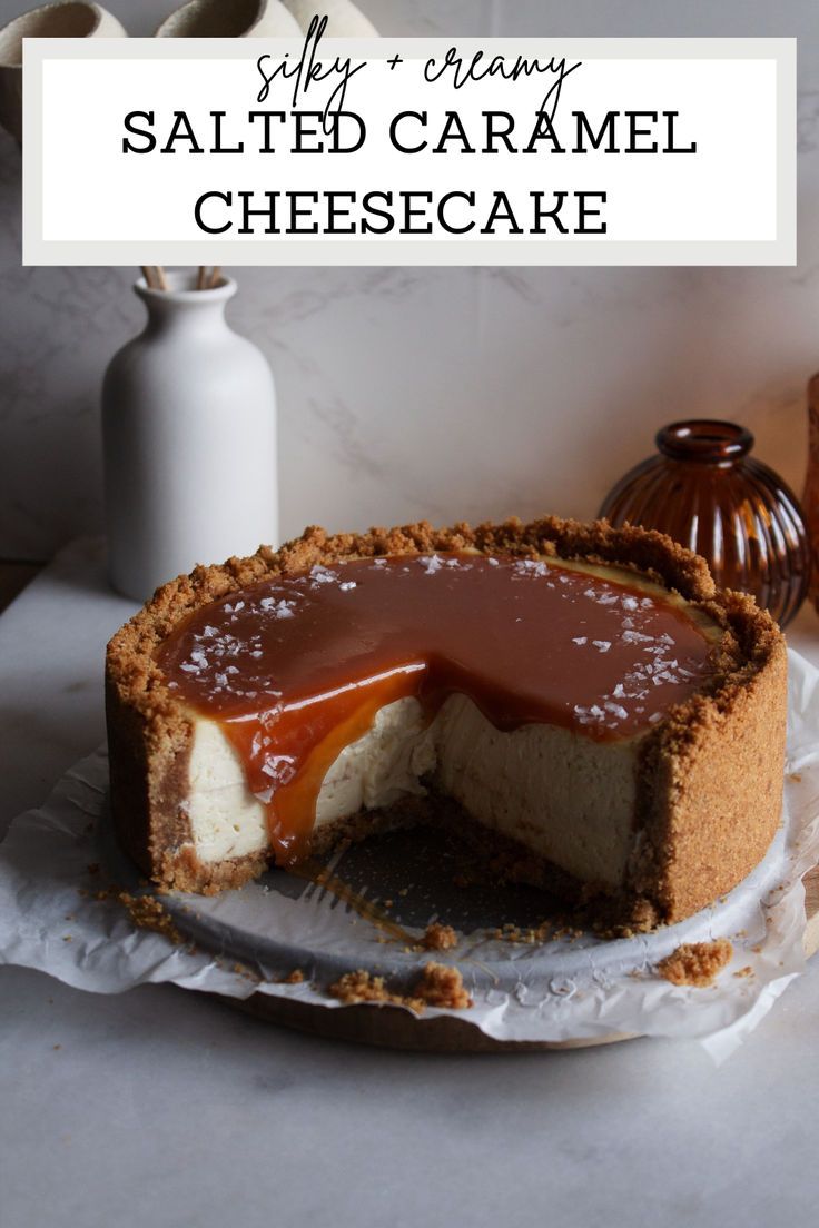 salted caramel cheesecake on a plate with a slice cut out and served