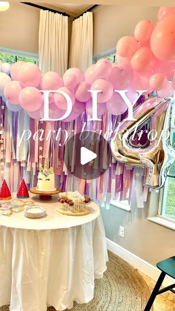 a birthday party with balloons, cake and desserts on a table in front of a window