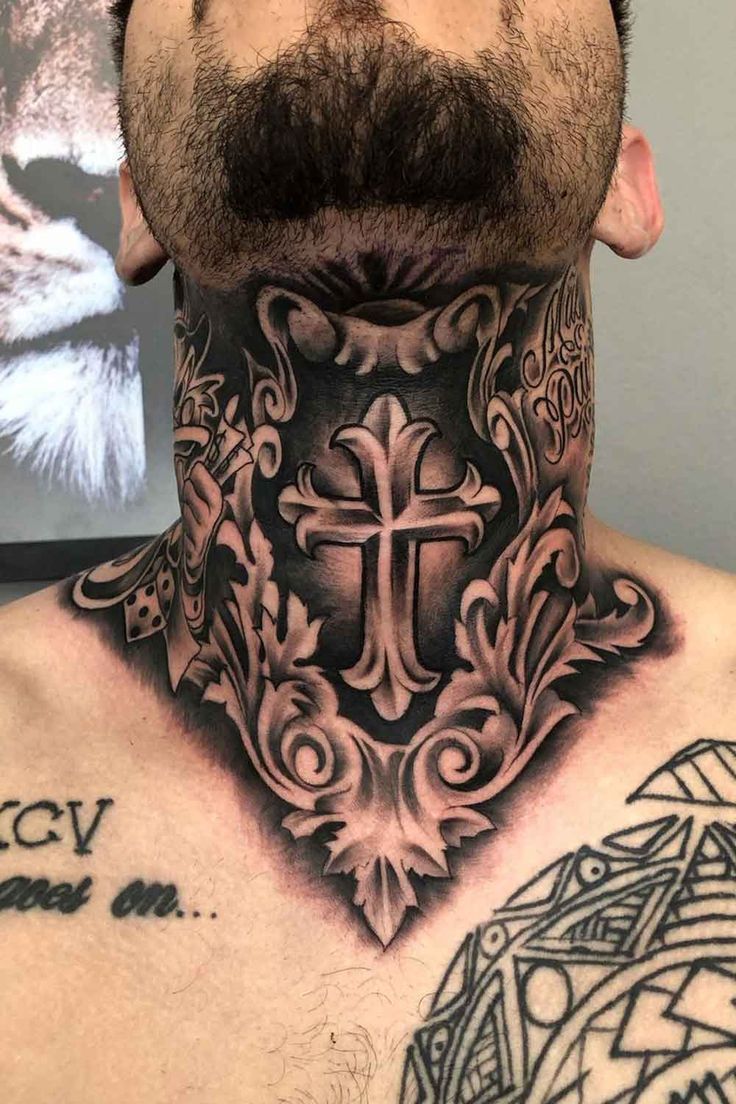 a man with a cross tattoo on his neck