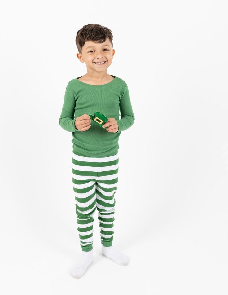 Every Kids Green Top & Stripes Pajamas is sure to give the best night of rest and keep your child comfortable while lounging around the house. These 100% cotton pajamas are designed with green and white stripes across the bottom set, along with a solid colored green for the long-sleeved shirt! Tagless labels are implemented for scratch-free comfort and ribbed cuffs at the wrists and ankles for extra mobility. Each imported outfit is carefully designed to fit snugly around your child for protecti Green Cotton Tops For Pajama Party, Playful Green Sets For Sleepovers, Playful Green Sets For Sleepover, Playful Green Sleepover Sets, Playful Green Tops For Sleepover, Playful Green Sets For Pajama Party, Green Long Sleeve Bedtime Sets, Green Cotton Sleepwear, Green Cotton Sleepover Sets