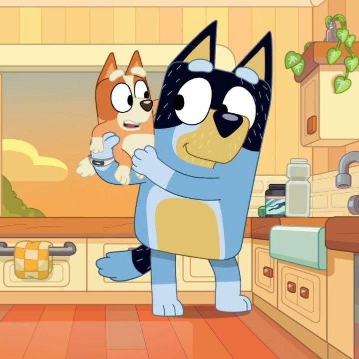 a cartoon cat and dog standing in a kitchen