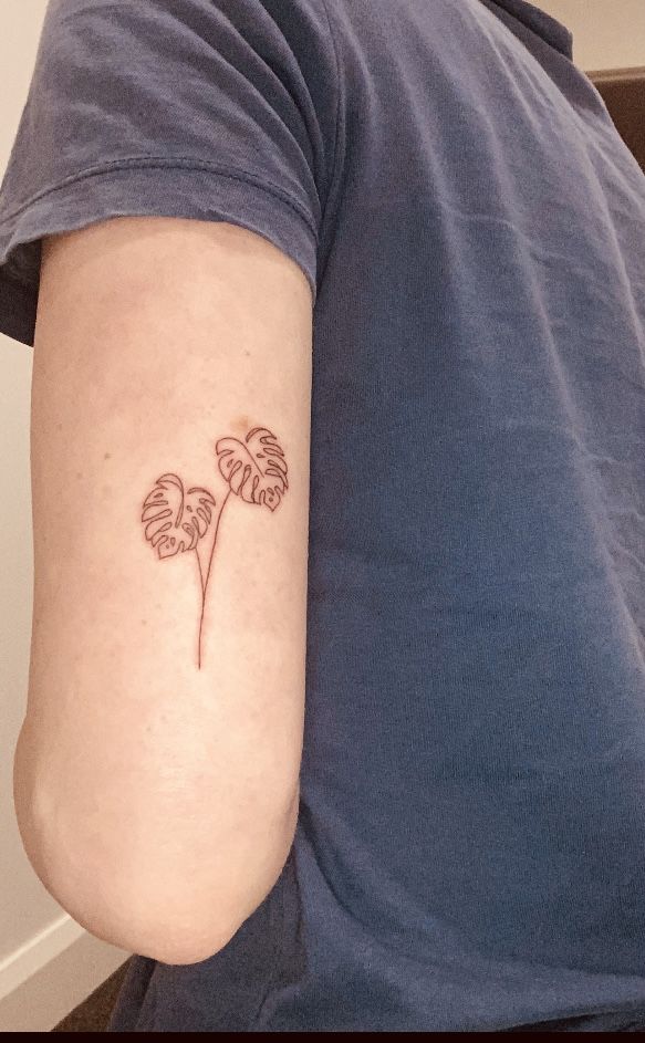 a person with a flower tattoo on their arm