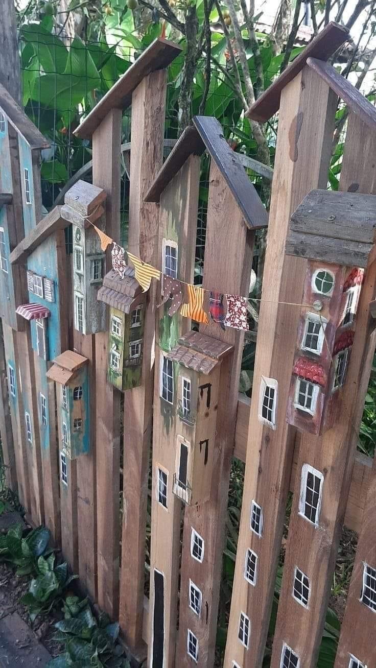 a fence made out of wooden boards and windows