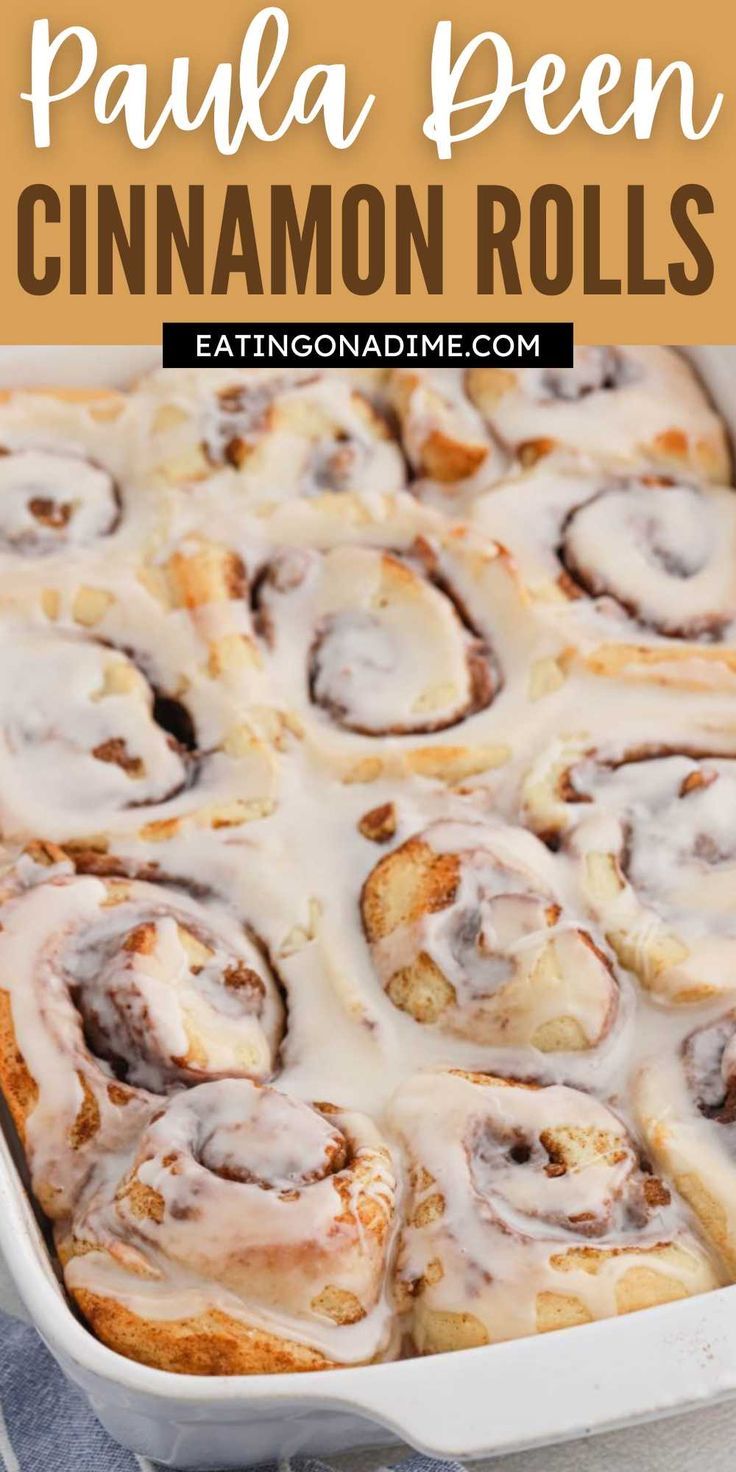 a pan filled with cinnamon rolls covered in icing