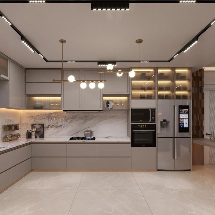 a modern kitchen with marble counter tops and stainless steel appliances, along with recessed lighting