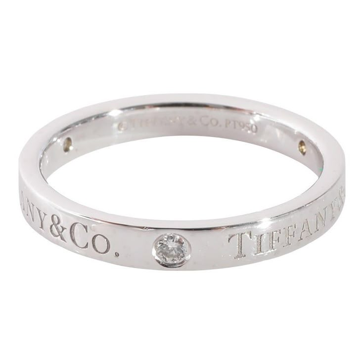 This is part of Chairish’s Fine Jewelry assortment.  Tiffany & Co. Diamond Band in 950 Platinum 0.07 CTW  PRIMARY DETAILS  SKU: 125350  Listing Title: Tiffany & Co. Diamond Band in 950 Platinum 0.07 CTW  Condition Description: Retails for 2250 USD. In excellent condition and recently polished. Ring size is 6.25. Comes with Box.  Brand: Tiffany & Co.  Metal Type: Platinum  Metal Purity: 950  Ring Size: 6.25  Pre-Owned Jewelry Condition: Excellent  SIDE STONE INFORMATION  Side Stone 1 Gem Type: Di Luxury Sterling Silver Jewelry With Single Diamond, Luxury Diamond White Ring With Polished Finish, Luxury Diamond Ring With Single Diamond In Round Band, Luxury Diamond White Rings With Polished Finish, Luxury White Gold Diamond Ring With White Topaz, Elegant 14k White Gold Stackable Rings, Timeless Sterling Silver Birthstone Ring, Polished Diamond Stackable Rings, Elegant Crystal Ring With Single Diamond