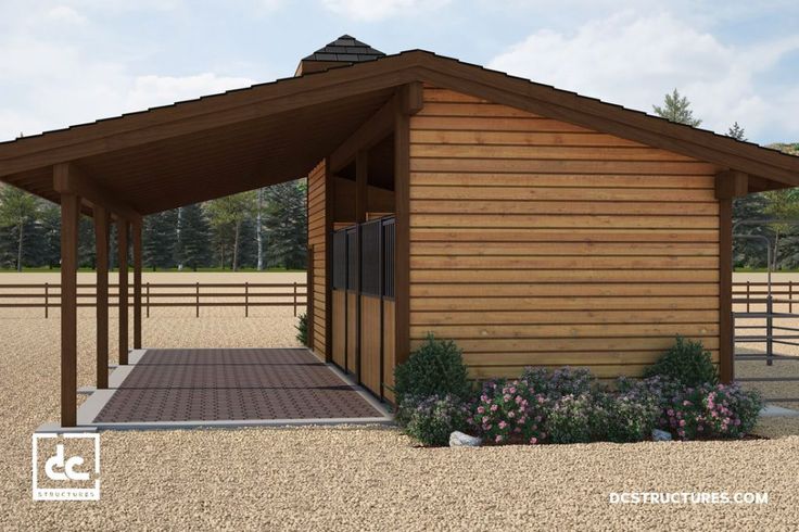 a small wooden building sitting on top of a dirt field