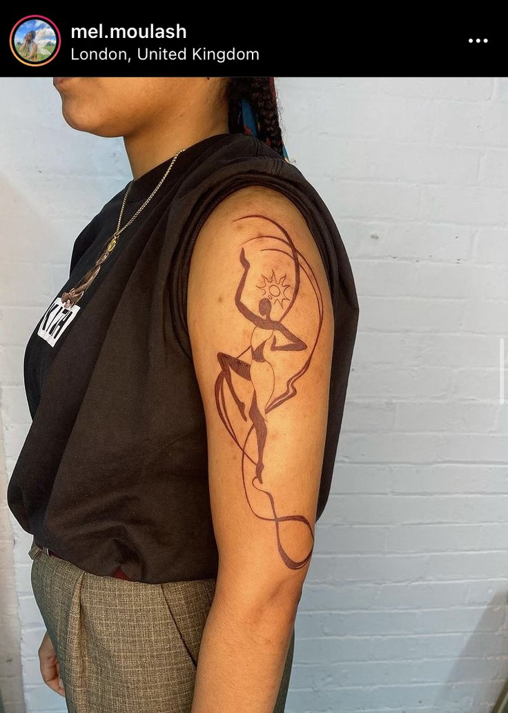 a woman with a tattoo on her arm