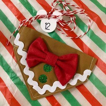 an ornament with a red bow on it sitting on top of a table