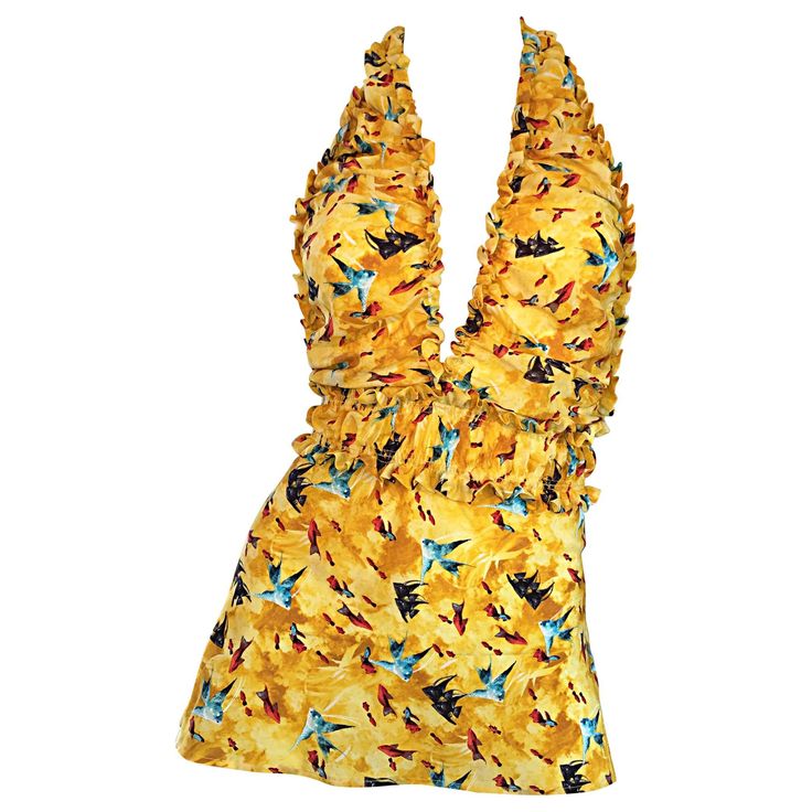 Sexy vintage FENDI, by Karl Lagerfeld, early 1990s silk halter top! Features awesome prints of fish throughout. Plunging neckline, with ruffles at bodice and waist. Very flattering. Mustard Yellow color, with blue and red fish. Can easily go from day to night. Great with shorts or jeans for day, and perfect with a skirt for evening. In great condition. Made in Italy Approximately Size Small - Medium (lots of stretch) Measurements: 32-40 inch bust 26-34 in waist (elastic waistband) Fendi Blouse, Karl Lagerfeld Fendi, Fendi Outfit, Halter Neck Tops, Fendi Runway, Plunging Neckline Top, Vintage Halter Top, Yellow Halter Top, Silk Halter Top