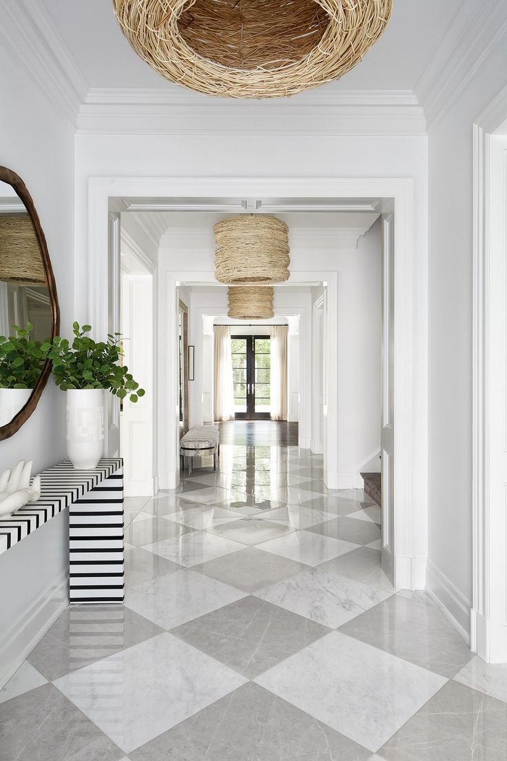 the hallway is clean and ready to be used as an entrance way for someone's home