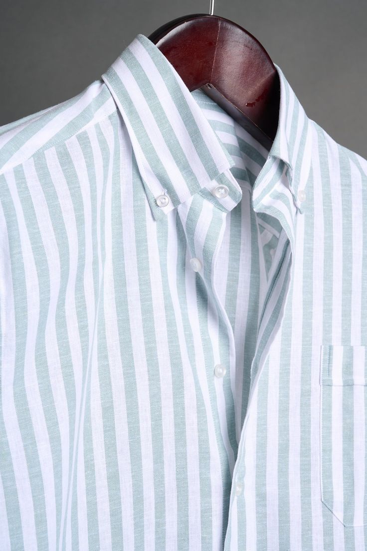 A bespoke shirt crafted from a textured cotton blend fabric in an oversized candy stripe. The larger striped pattern gives it a punch of style, making it a great casual shirt that can be worn with chinos or jeans - or under suits and jackets. The lightweight fabric drapes effortlessly, making it an ideal choice for those seeking a sophisticated yet relaxed look. White Relaxed Fit Yarn-dyed Shirt, Classic Striped Linen Tops, White Cotton Dress Shirt With Striped Collar, Cotton Vertical Stripes Collared Shirt, Spring Cotton Dress Shirt With Striped Collar, Casual Striped Dress Shirt For Summer, Striped Shirt With Relaxed Fit And Spread Collar, Yarn-dyed Striped Collared Shirt, White Horizontal Stripe Relaxed Fit Shirt