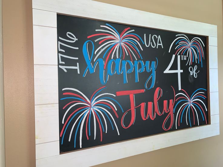 a chalk board with fireworks and the words happy 4th july