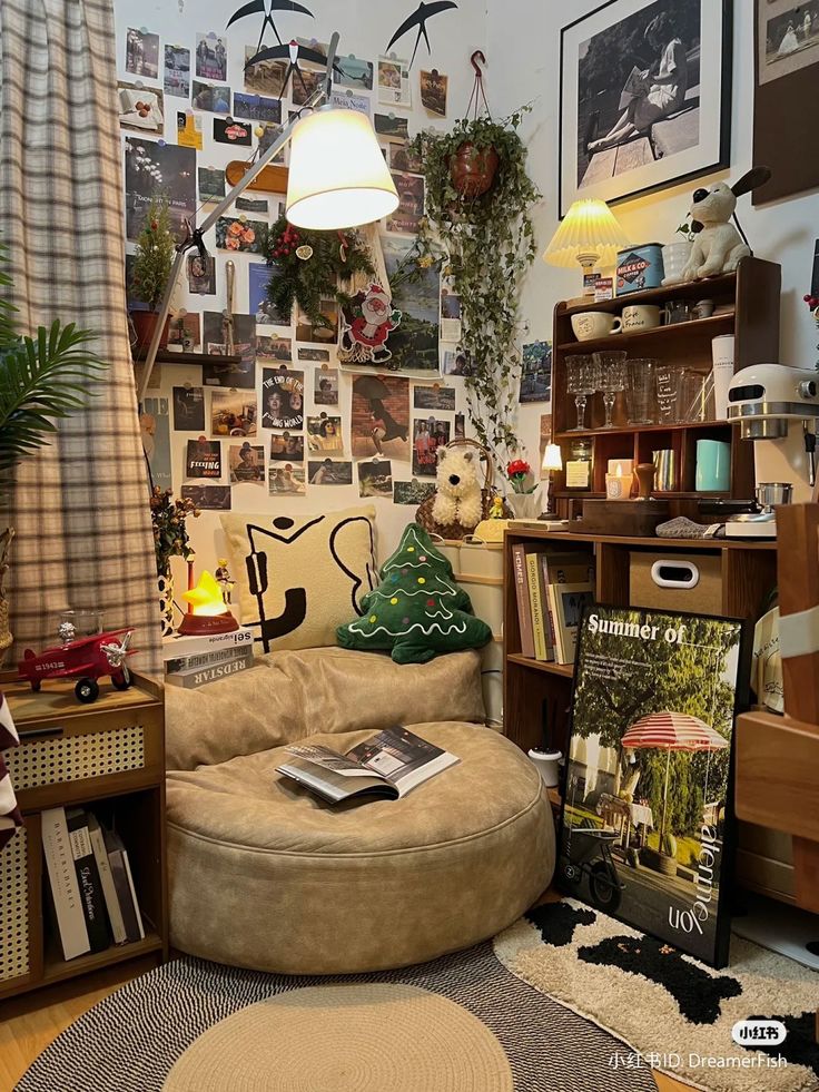 a living room filled with furniture and pictures on the wall next to a book shelf