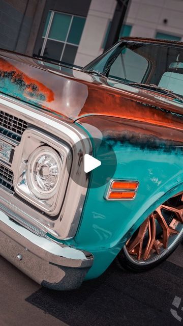 an old blue truck with rust on it's hood