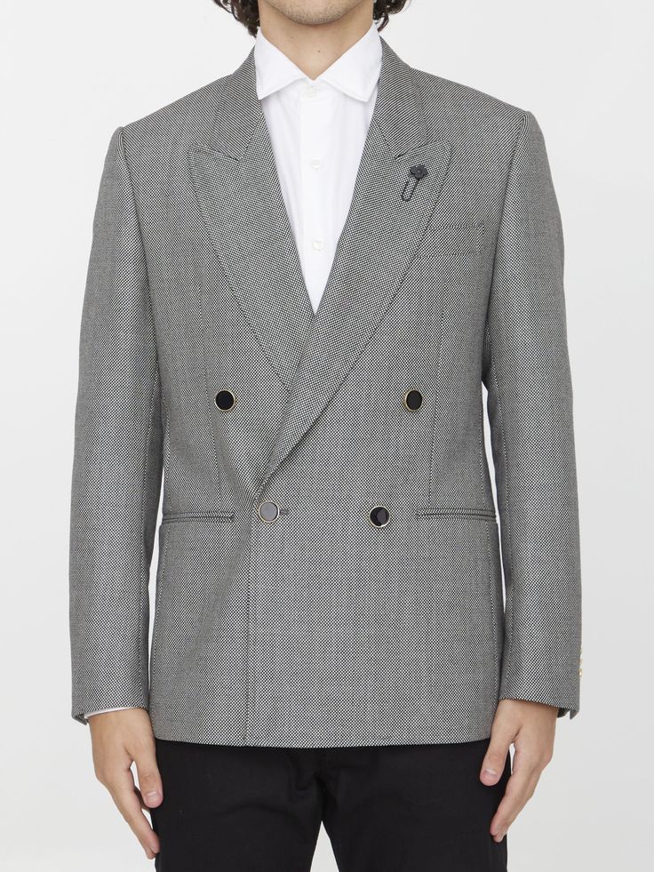 Double-breasted jacket in grey wool. It features peaked lapels, front four-button closure, two front welt pockets, a welt pocket on chest and buttoned cuffs. Regular fit. The model is 184cm tall and wears size IT 48.Size nationality: IT Product number: 37176789 Product code: 690661571901 Composition: 100% WOOL Wool Tuxedo Blazer With Double-breasted Button, Wool Tuxedo Blazer With Double-breasted Fastening, Winter Workwear Tuxedo With Lapel Collar, Double-breasted Tuxedo With Hidden Button Closure For Work, Gray Single Breasted Suit For Workwear, Winter Tuxedo With Lapel Collar, Gray Single-breasted Suit For Work, Fall Single Breasted Tuxedo For Office, Fall Office Tuxedo, Single Breasted