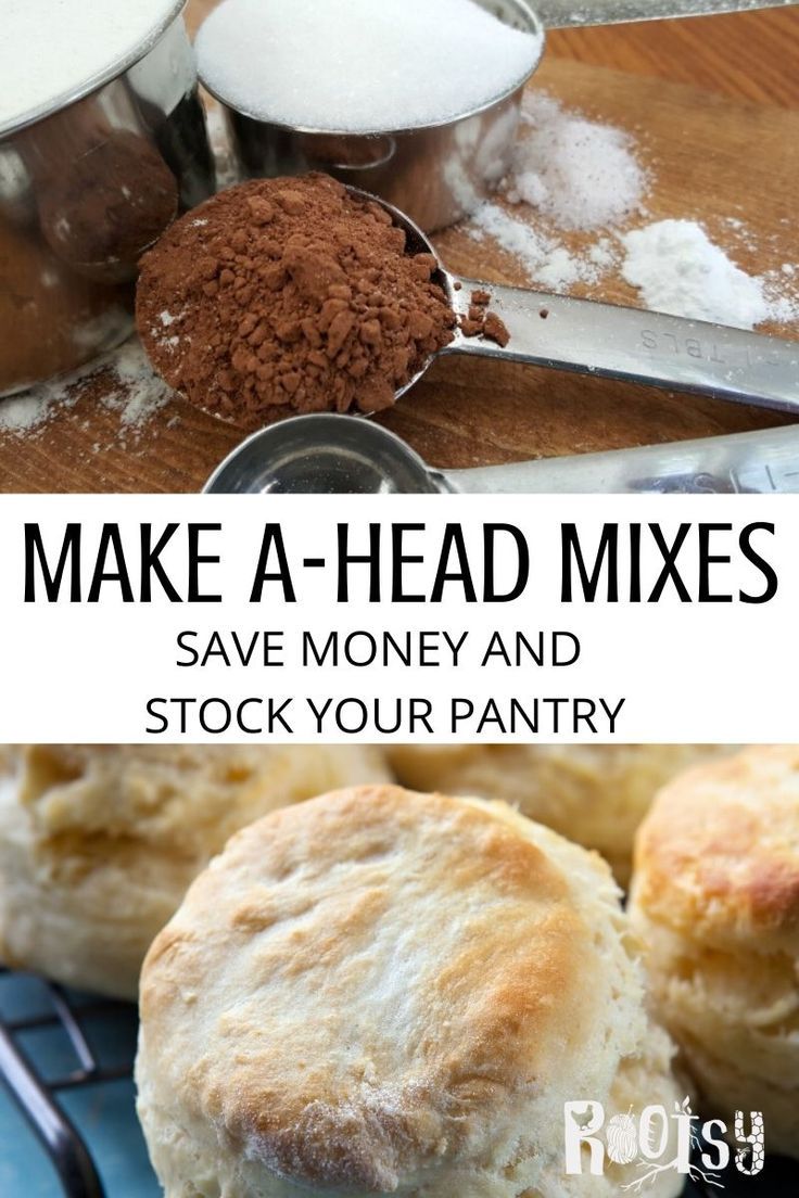 some biscuits are on a blue plate with measuring spoons and flour in the background