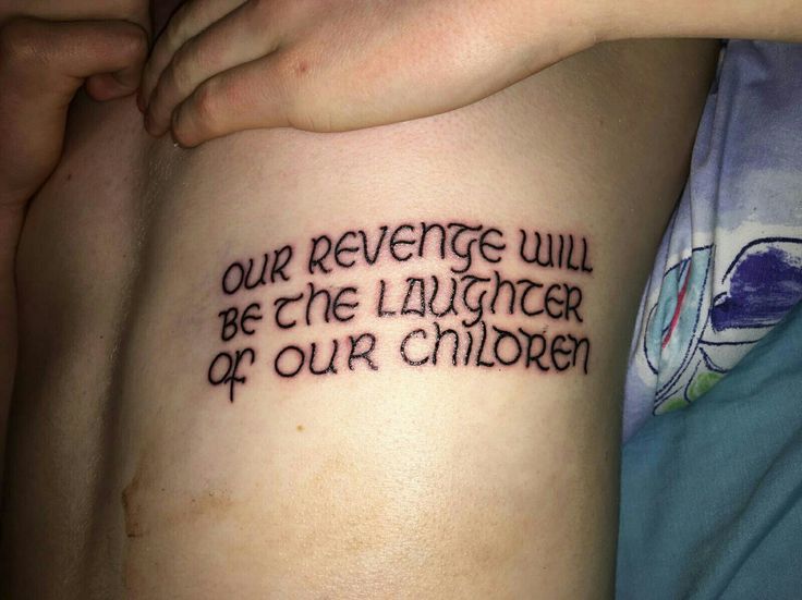 a person with a tattoo that says, our revege will be the laughter of our children