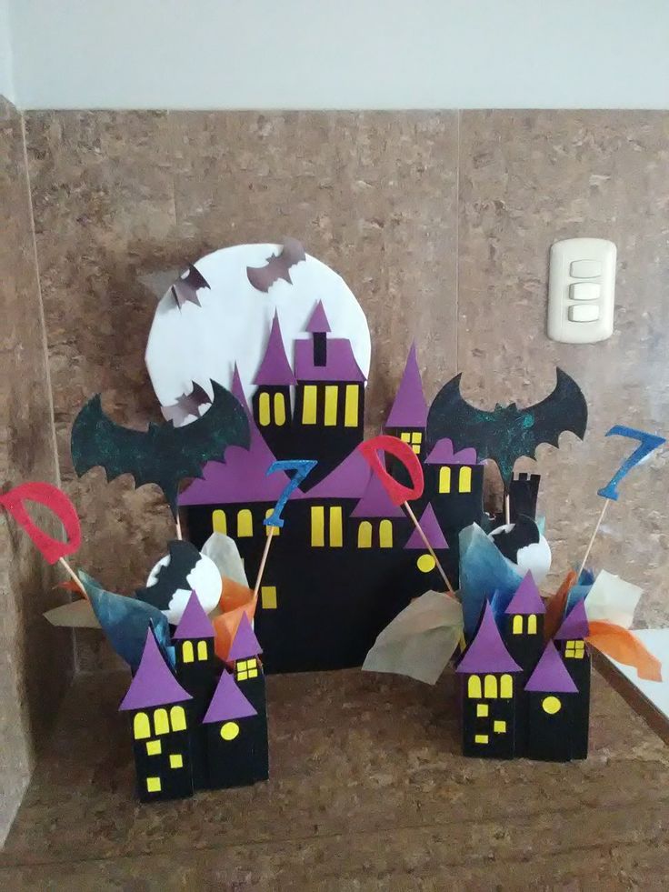 a castle made out of paper with bats on it