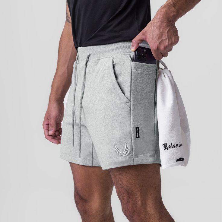 This relaxed hybrid short returns with an updated design featuring Sidelock drop pockets on both hips for out-of-the-way storage while training. Constructed in a standard fit from soft, breathable, and stretchy Tech-Terry™ fabric. Complete with a right-side zip pocket, a hidden back zip pocket, and a shirt loop. Thick embroidered logos and durable drawstrings complete this rugged design. Model is 5'11 170lbs and usually wears size M. This product fits true to size so he is wearing M for a relaxe Functional Relaxed Fit Athletic Shorts, Gray Athletic Fit Shorts, Relaxed Fit Running Activewear With Pockets, Gray Athletic Fit Moisture-wicking Shorts, Athletic Fit Functional Shorts With Pockets, Functional Athletic Fit Shorts With Pockets, Functional Shorts With Pockets Activewear, Athletic Fit Shorts With Pockets, Functional Athletic Shorts With Relaxed Fit And Built-in Shorts