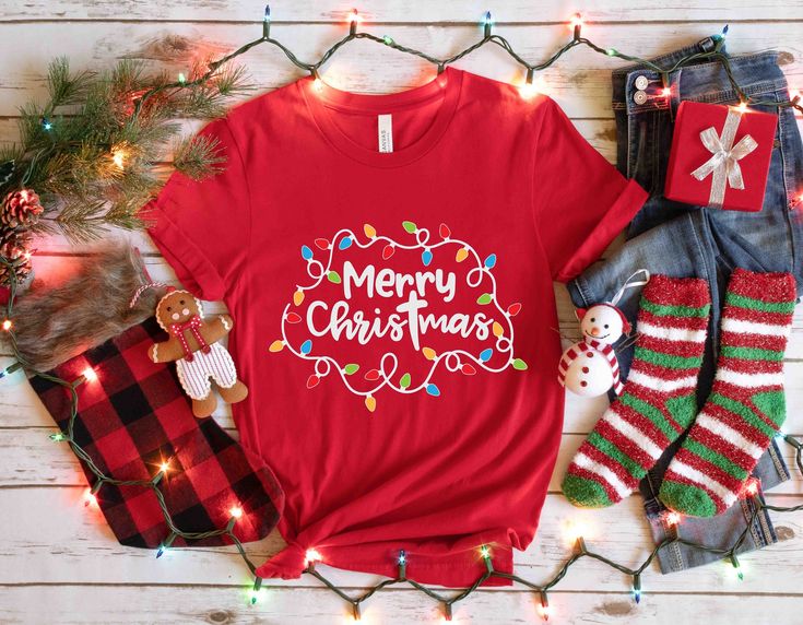 a t - shirt that says oh what tree it is to read next to christmas decorations