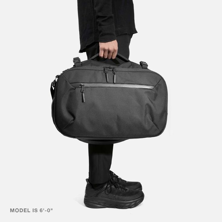 Travel Duffel - Black — Aer | Modern gym bags, travel backpacks and laptop backpacks designed for city travel Functional Bags With Luggage Sleeve For Commuting, Functional Commuter Bags With Luggage Sleeve, Functional Commuting Bags With Luggage Sleeve, Multifunctional Nylon Luggage For On-the-go, Practical Large Capacity Travel Accessories For On-the-go, Functional On-the-go Travel Bag With Zipper Pocket, Modern Nylon Luggage For On-the-go, Versatile Cases With Luggage Sleeve For Everyday Use, Multifunctional Travel Accessories For On-the-go