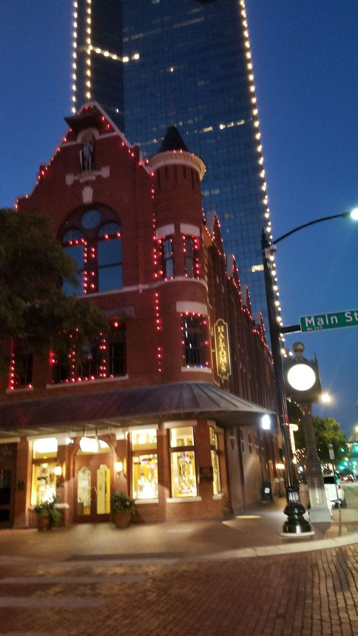 a red brick building with christmas lights on it