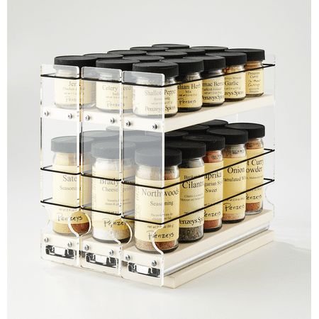 the spice rack is filled with many different kinds of spices