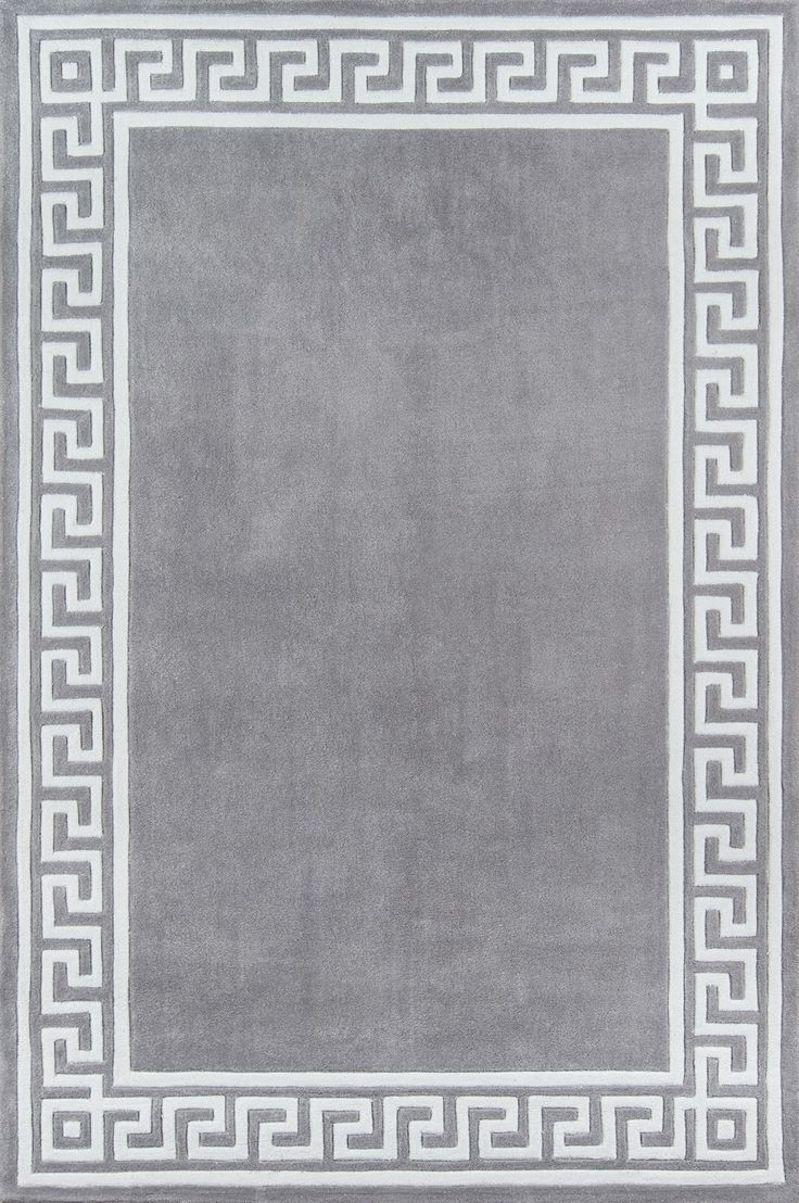 a gray rug with white greek border