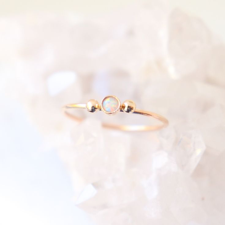 A solid 14k gold little beauty. Our dainty little gold diamond ring is accompanied by two solid 14k gold dew drops. Perfectly understated, feminine and sweet. Personalize your slim gold ring by selecting a stone to represent a birthday, as an engagement ring or just because (see last photo)! {DETAILS}: * select a natural diamond or lab grown 3mm cz diamond / birthstone (all conflict free!) * solid 14k gold bezel cup and band * solid 14k gold drops (on either side of the gemstone) * 1mm solid 14k Stackable Birthstone Rings, Diamond Birthstone, Mother Rings, 14k Gold Ring, Cz Diamond, Gold Diamond Rings, Birthstone Ring, Natural Diamonds, Diamond Ring