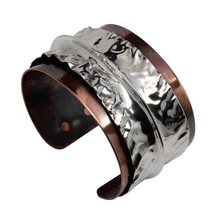 This extra-funky copper cuff bracelet features a layer of brilliant Argentium Silver that was hand-molded to perfection. The copper base layer was antiqued for extra drama. The mixed metal helps this bracelet flow seamlessly with a wide variety of looks. 6 inches, adjustable This bracelet is made to order. Production time is two weeks. Due to handmade craftsmanship, please expect slight variations from the photo. Elegant Hand Forged Cuff Bracelet, Luxury Hammered Cuff Bracelet, Unique Adjustable Cuff Bracelet With Polished Finish, Luxury Hammered Bangle Cuff Bracelet, Unique Hand Forged Cuff Bracelet For Formal Occasions, Unique Hand Forged Cuff Bracelet For Formal Events, Luxury Wide Band Cuff Bracelet As Gift, Luxury Wide Band Cuff Bracelet Gift, Elegant Hand Forged Cuff Bracelet For Formal Occasion