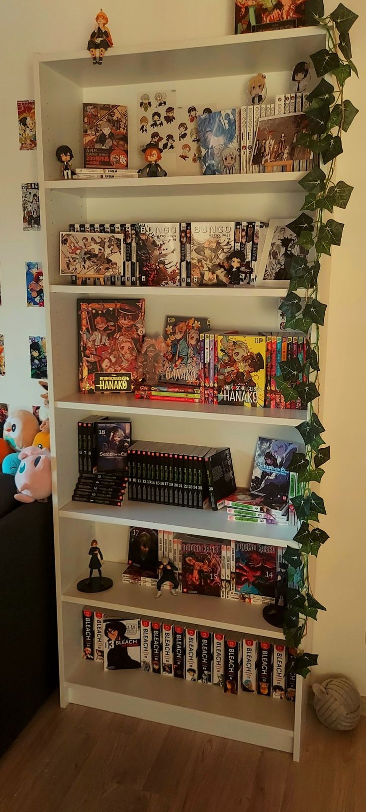 a bookshelf filled with comics and games