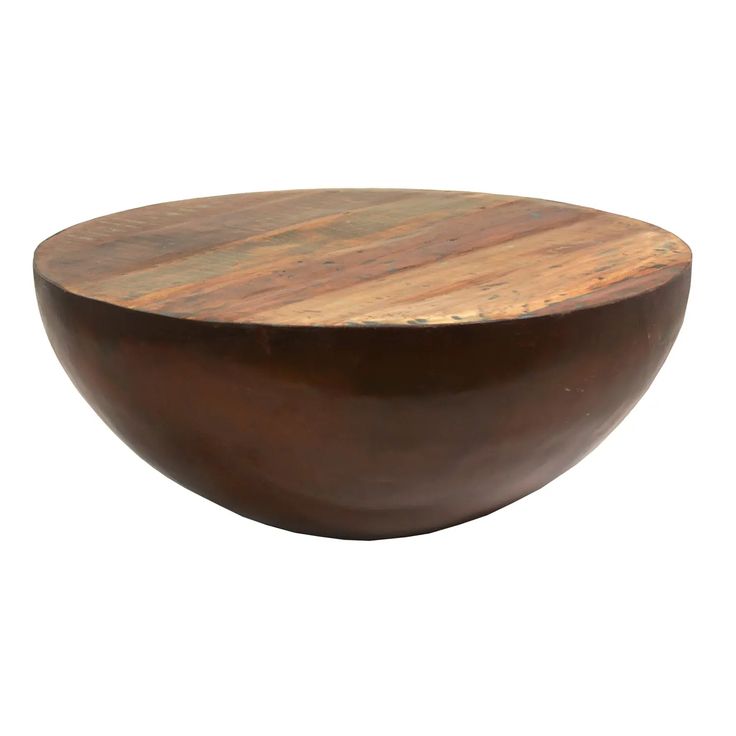 a wooden bowl sitting on top of a table