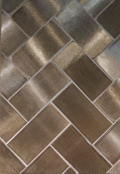 a close up view of a metal tile wall