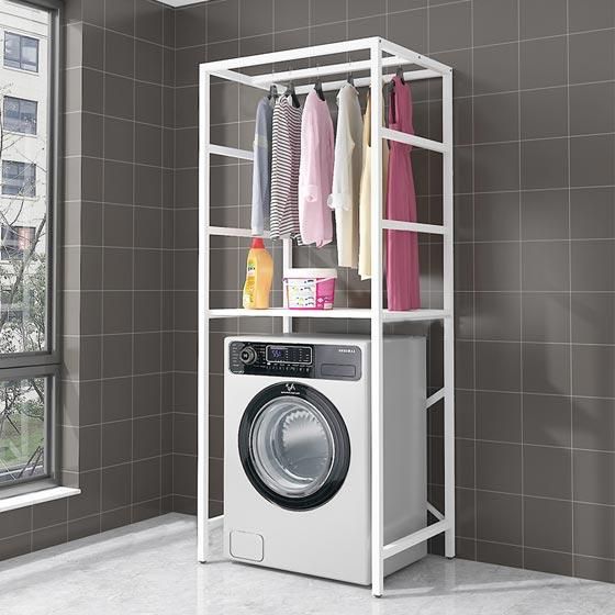 a washer and dryer sitting in front of a window next to a tiled wall