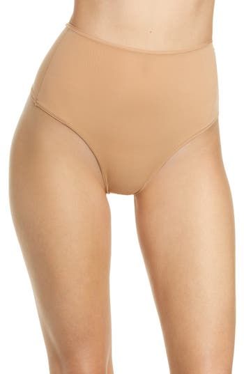 Enjoy the invisibility of a thong while retaining the breathability of quick-dry fabric with this comfortable option from Kim Kardashian West's SKIMS. Reflecting the brand’s passion for underwear solutions for every body, this low-rise style—available in four different colors—is destined to be a part of your regular rotation. Cotton-lined gusset 76% polyamide, 24% elastane Machine wash, tumble dry Imported Women's Clothing Second-skin Shapewear, Solid Color Second-skin Shapewear, Stretch Shapewear Briefs, Seamless Stretch Bodysuit With High-cut Leg, High-cut Leg Shapewear With Lined Body, Fitted High-cut Leg Shapewear With Moderate Coverage, Smoothing Shapewear With Minimal Stretch, Fitted Shapewear With Moderate Coverage And High-cut Leg, Seamless Stretch Bodysuit Full Coverage