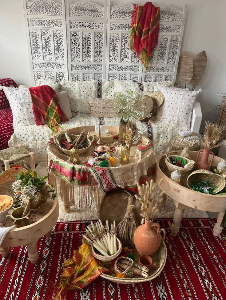 a room filled with lots of different types of items on the floor next to a couch