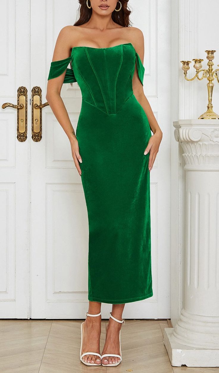 This stunning dress is designed to flatter your curves and accentuate your feminine figure, with an off-shoulder neckline that adds a touch of drama and a corset bodice that cinches your waist. Crafted from high-quality stretch fabric, this dress is both comfortable and stylish. The eye-catching green hue is perfect for those who love to stand out, while the midi length and elegant design make it a versatile choice for a range of occasions. Gentle Dry Clean OnlyColour may vary due to lighting on