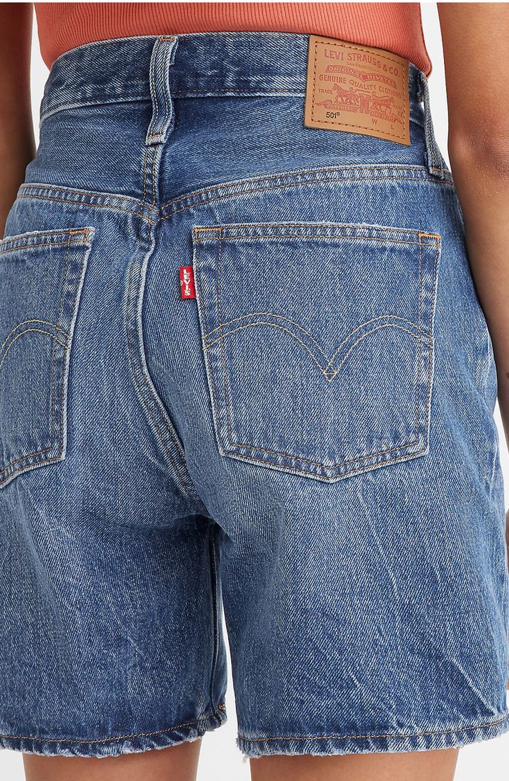 An update to the iconic 501 silhouette, these nonstretch-denim shorts feature a marbled medium wash, subtly distressed edges and a comfy mid-thigh length. 6" inseam; 22" leg opening; 11 1/2" front rise; 15" back rise (size 29) Button fly Five-pocket style 100% cotton Machine wash, tumble dry Made in Turkey Levi’s 501 Shorts, Levi’s Shorts, Levi Outfits Women, Mid Thigh Denim Shorts, Jorts Women, Levis Outfit, Thrift Inspo, Mood Clothes, Mid Thigh Shorts