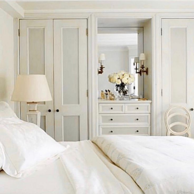 a bedroom with white furniture and decor on instagram